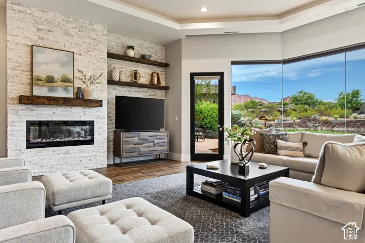 Stacked stone fireplace with a wood-beam mantel
