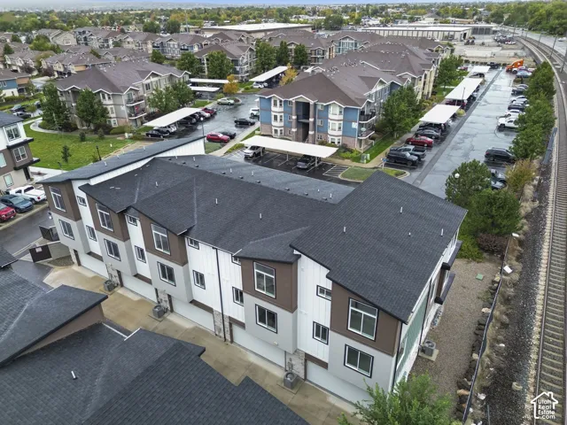 Multi-story residential building with vertical siding accents