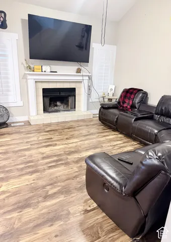 Fireplace with a tile surround and mantle