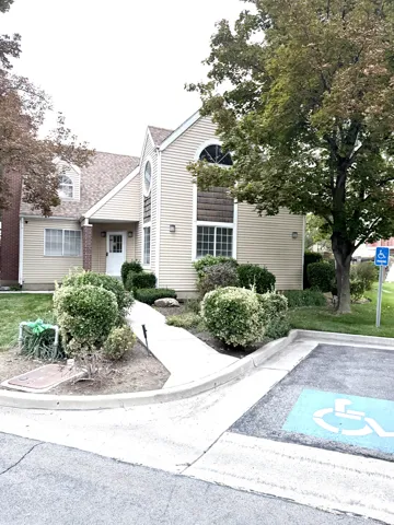 Siding exterior with multiple gables and a rounded window detail