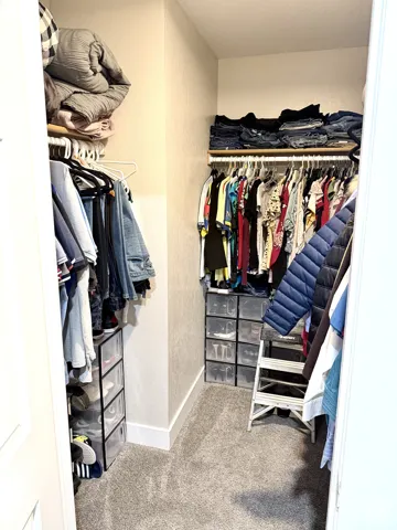 Built-in closet system with shelving and hanging rods