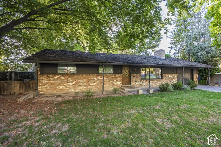 Brick and siding exterior with mature trees