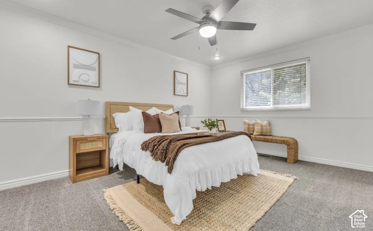 Window, ceiling fan with integrated lighting, wall trim molding, recessed lighting, and carpeted flooring