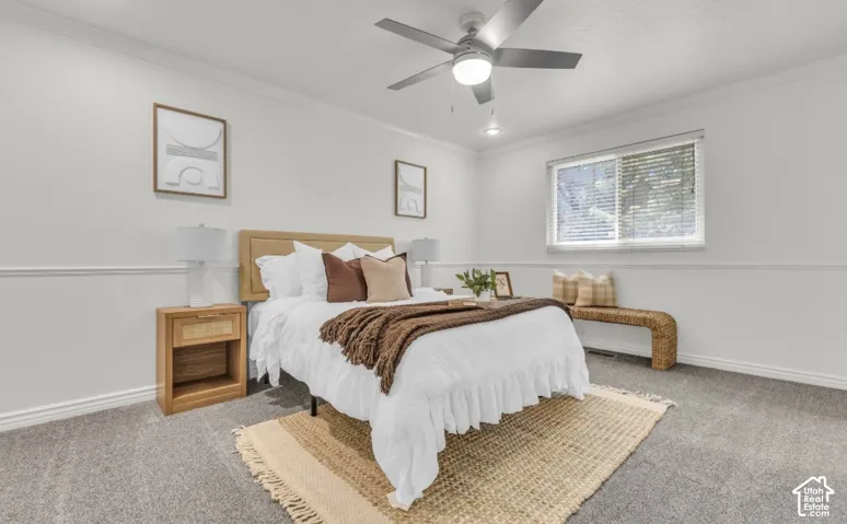 Window, ceiling fan with integrated lighting, wall trim molding, recessed lighting, and carpeted flooring