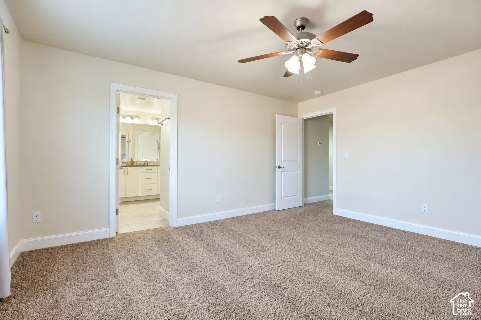 Carpeted flooring with light-toned walls