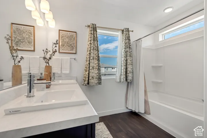 Dual vanity with white undermount sinks, chrome fixtures, and a light-toned countertop