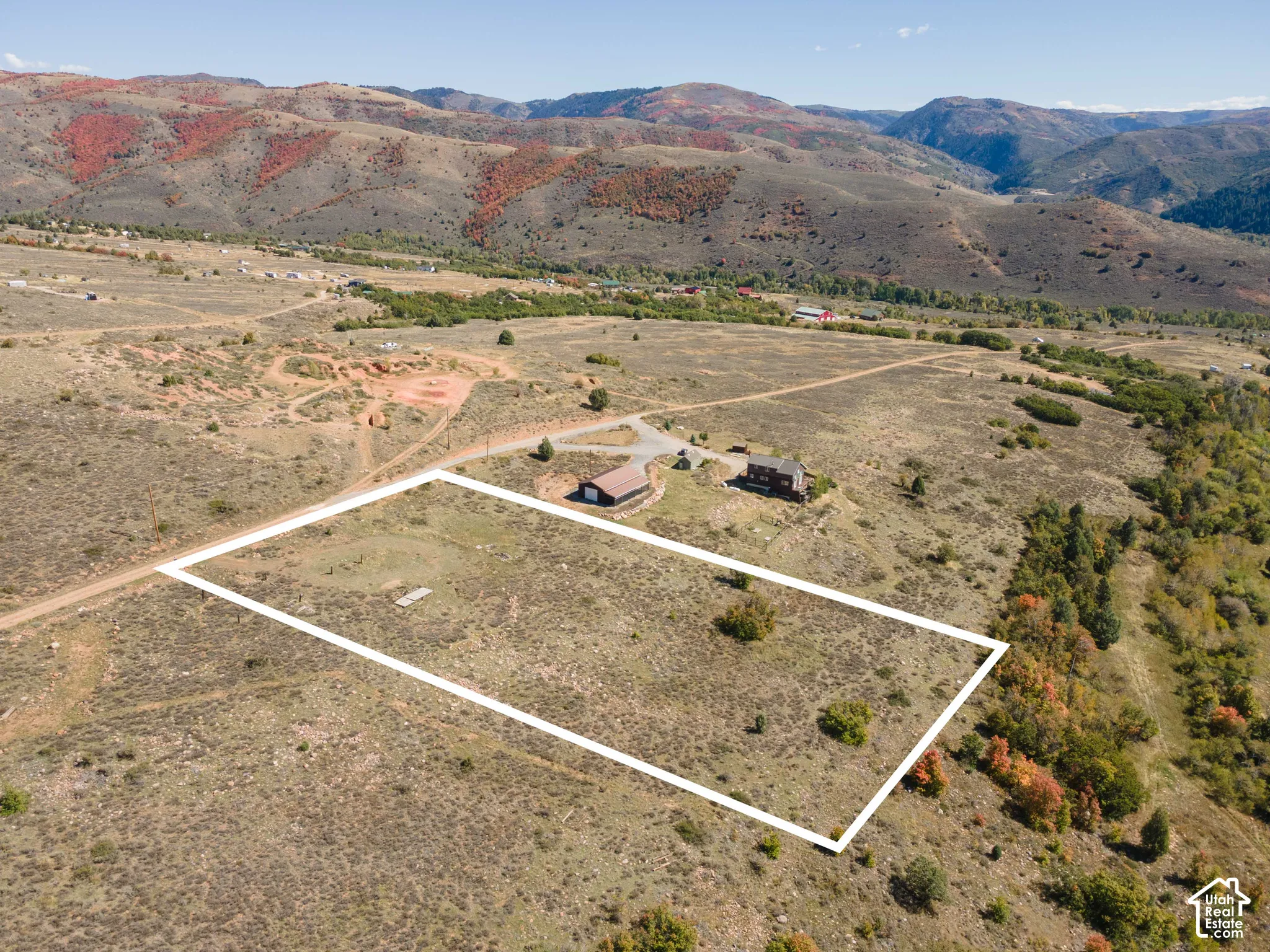 Expansive parcel featuring a natural, undeveloped landscape and distant mountainous terrain