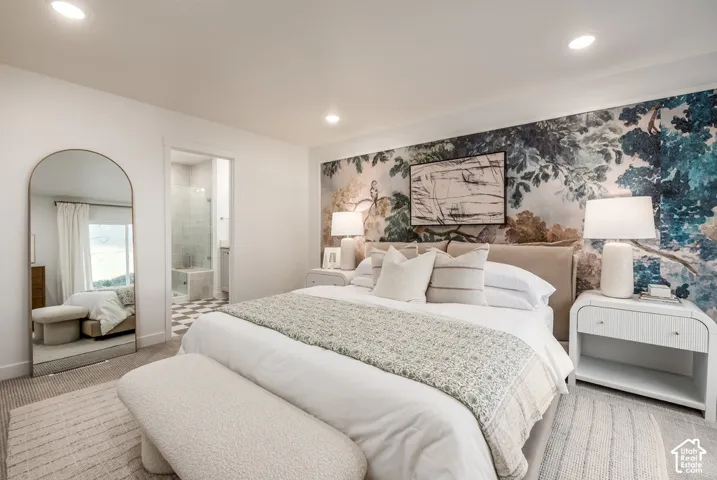 Recessed lighting, accent wall with botanical motif, and a framed art piece