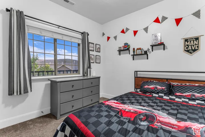 White walls with gray carpeting provide a neutral backdrop