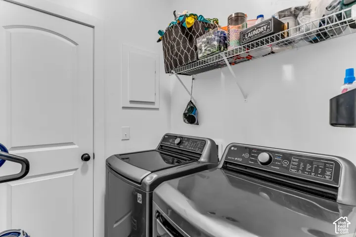 White interior door with dark hardware, wire shelving, and built-in appliances