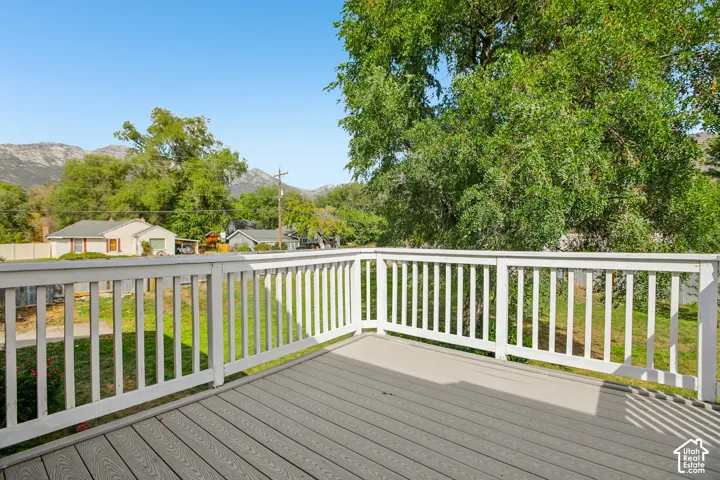 Expansive deck featuring composite decking and white railing