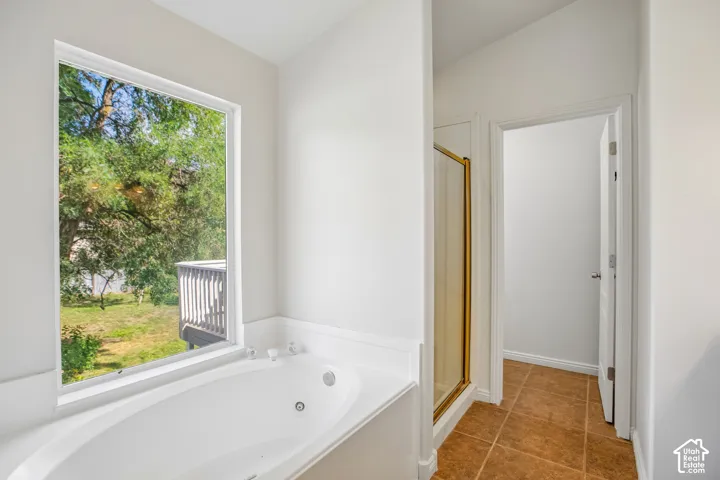 Soaking tub with integrated jets and a large window