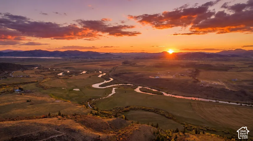 Expansive river landscape with meandering waterways and distant mountain ranges