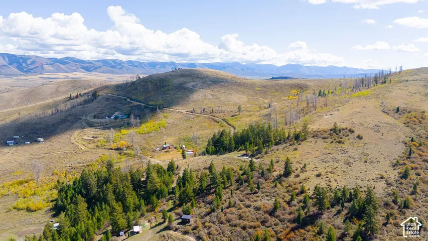 Expansive land parcel featuring diverse topography and natural vegetation