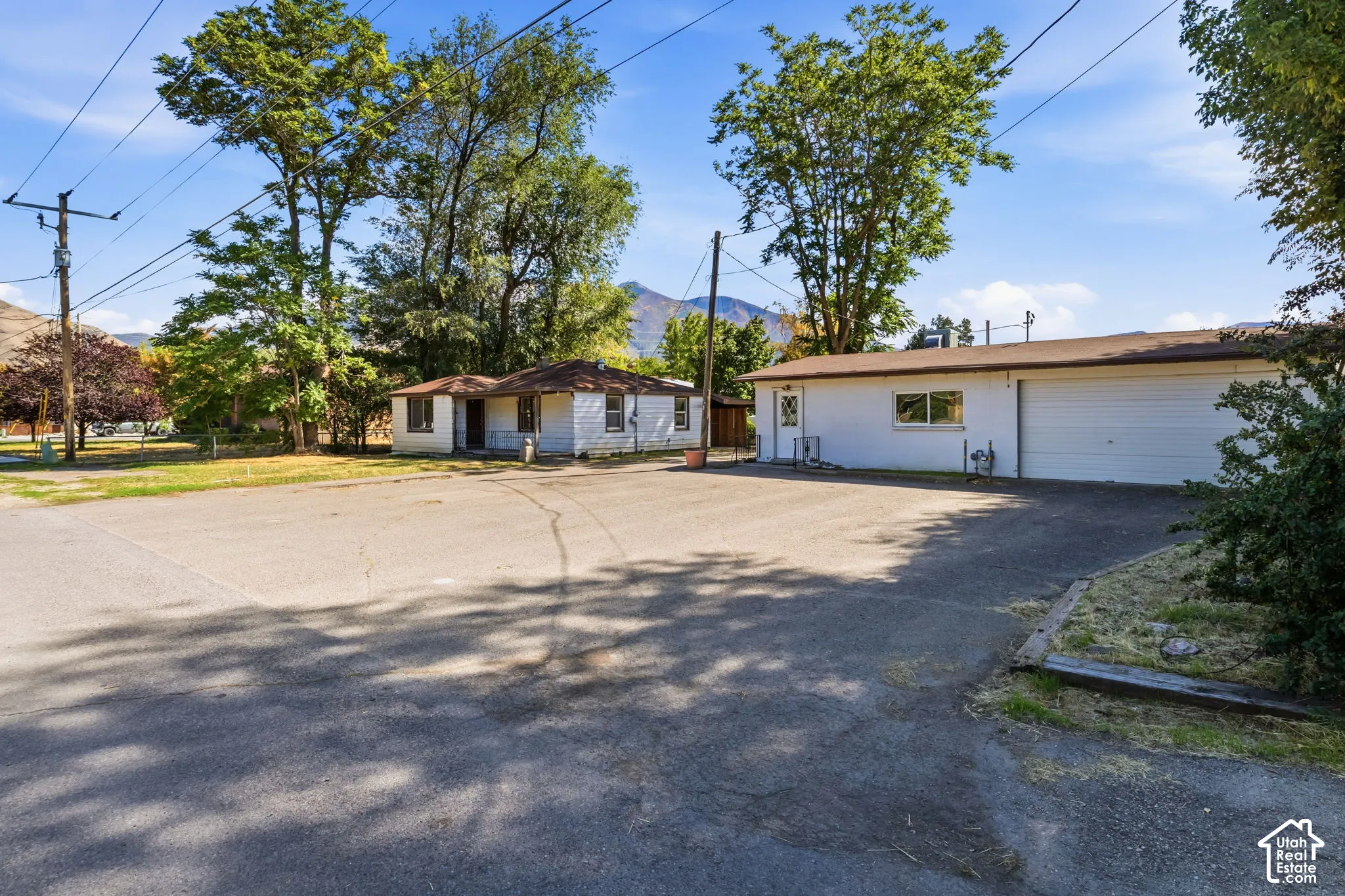 asphalt parking, could be home business or detached ADU with single family home