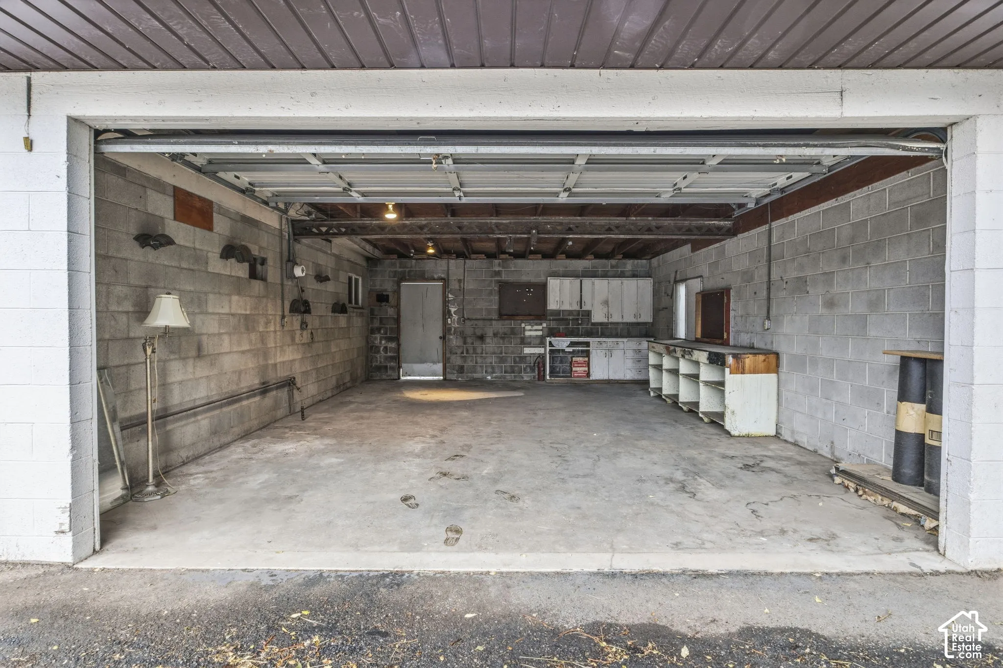 Garaged attached to Detached building - Concrete block interior walls with exposed wood beam ceiling