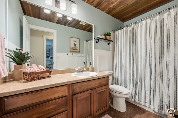 Wood-plank ceiling with recessed lighting