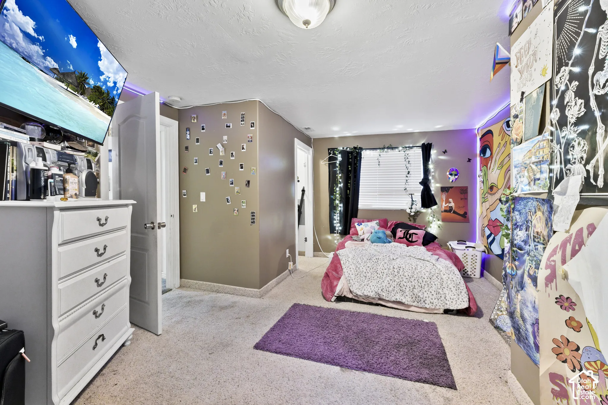 Wall-to-wall carpeting with painted walls and a ceiling-mounted light fixture