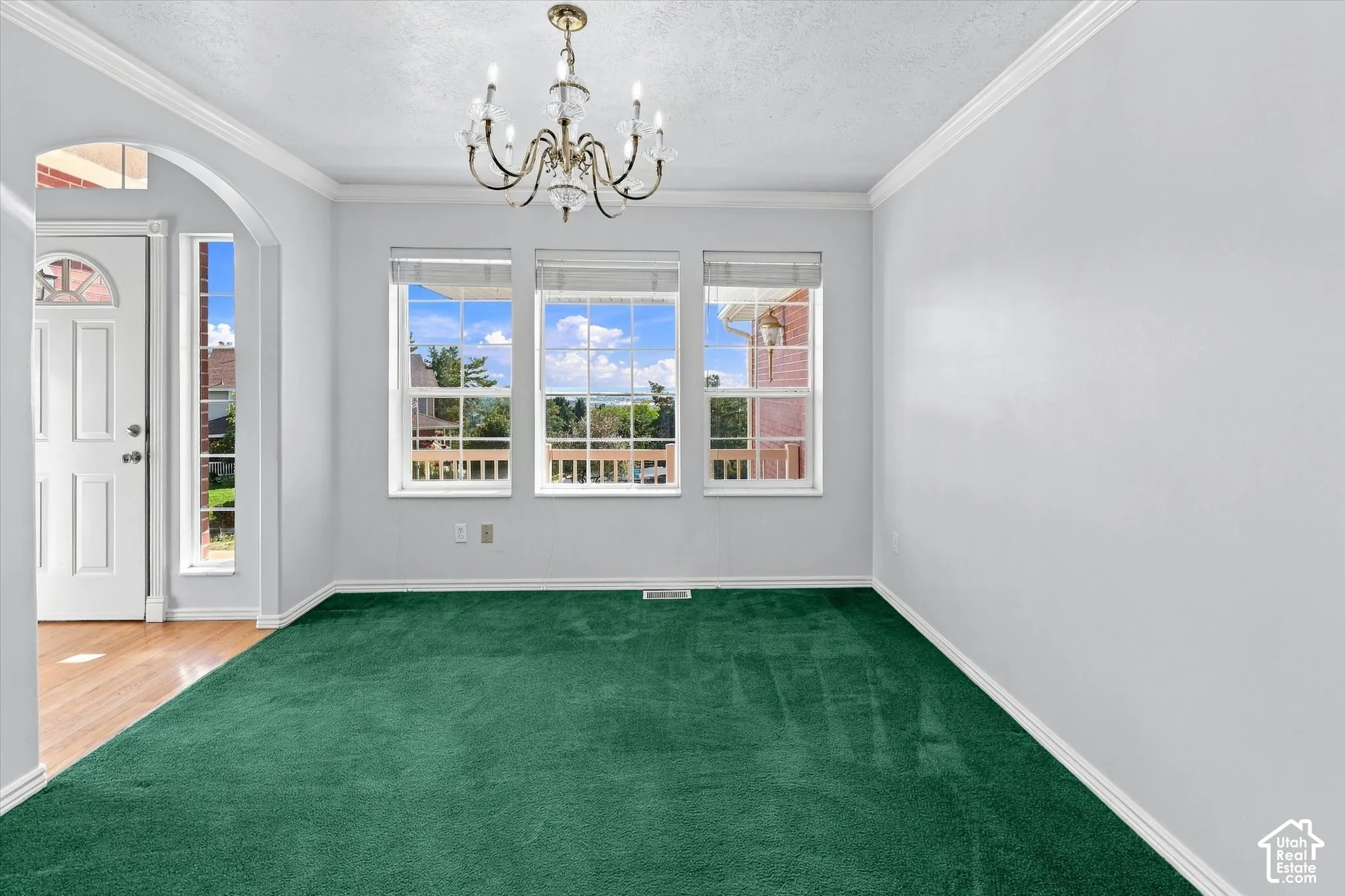 White front door with an arched transom window