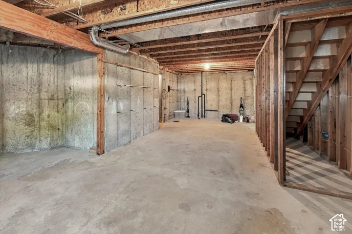 Concrete flooring with exposed ceiling joists and wood beam construction