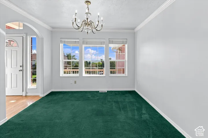 Archway entry with wood-finish flooring