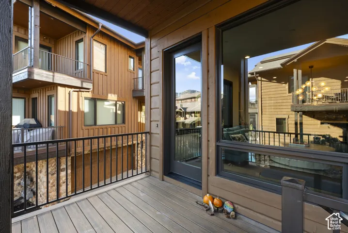 Deck with composite wood-finish flooring and black metal railings