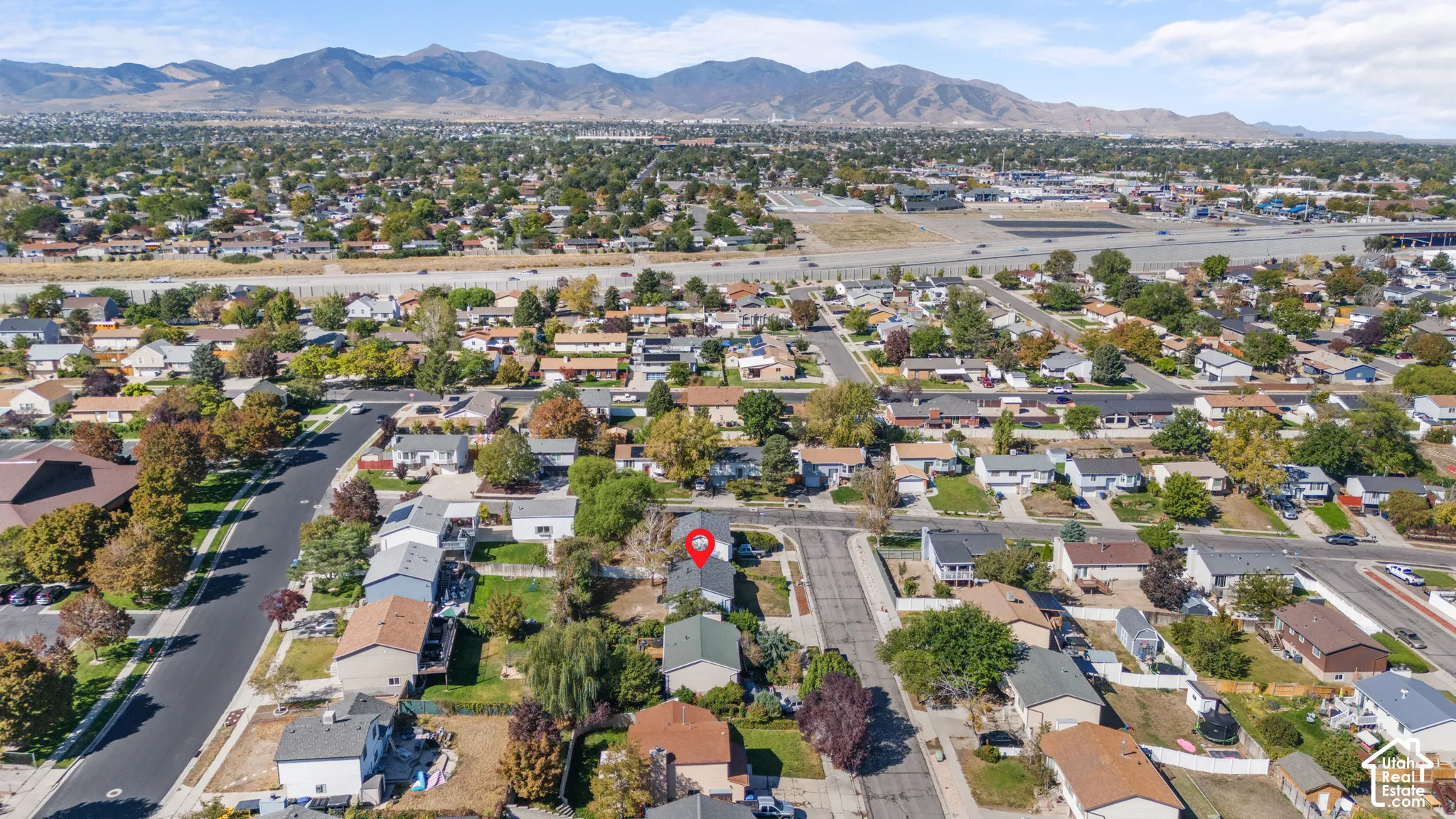 Expansive residential neighborhood with distant mountain ranges