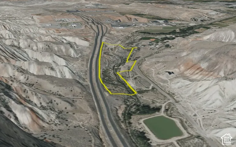 Aerial Property View. Outlining the property boundaries in a mountainous region with roadways and water features