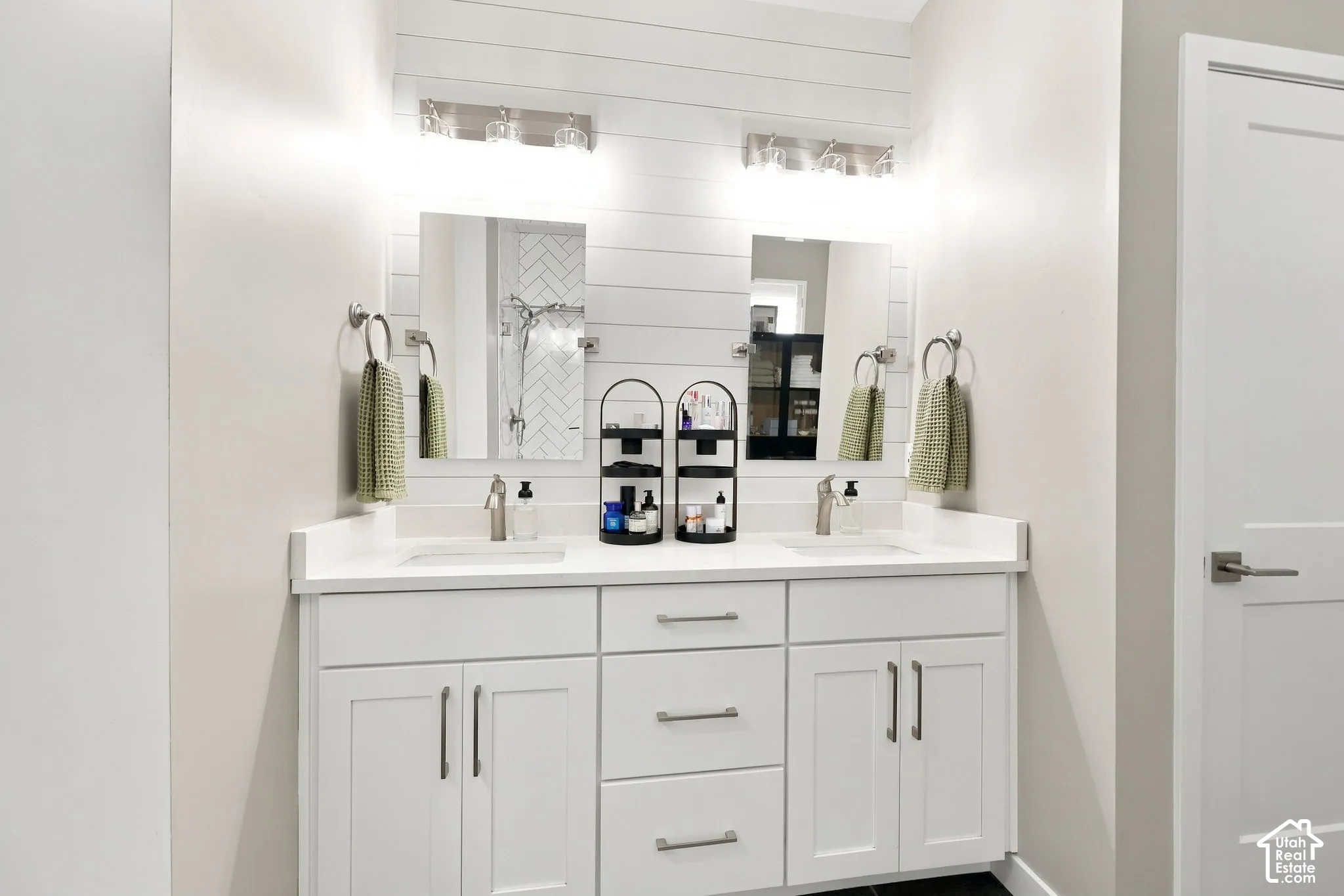 Dual vanity with shaker-style cabinetry, white countertops, and undermount sinks