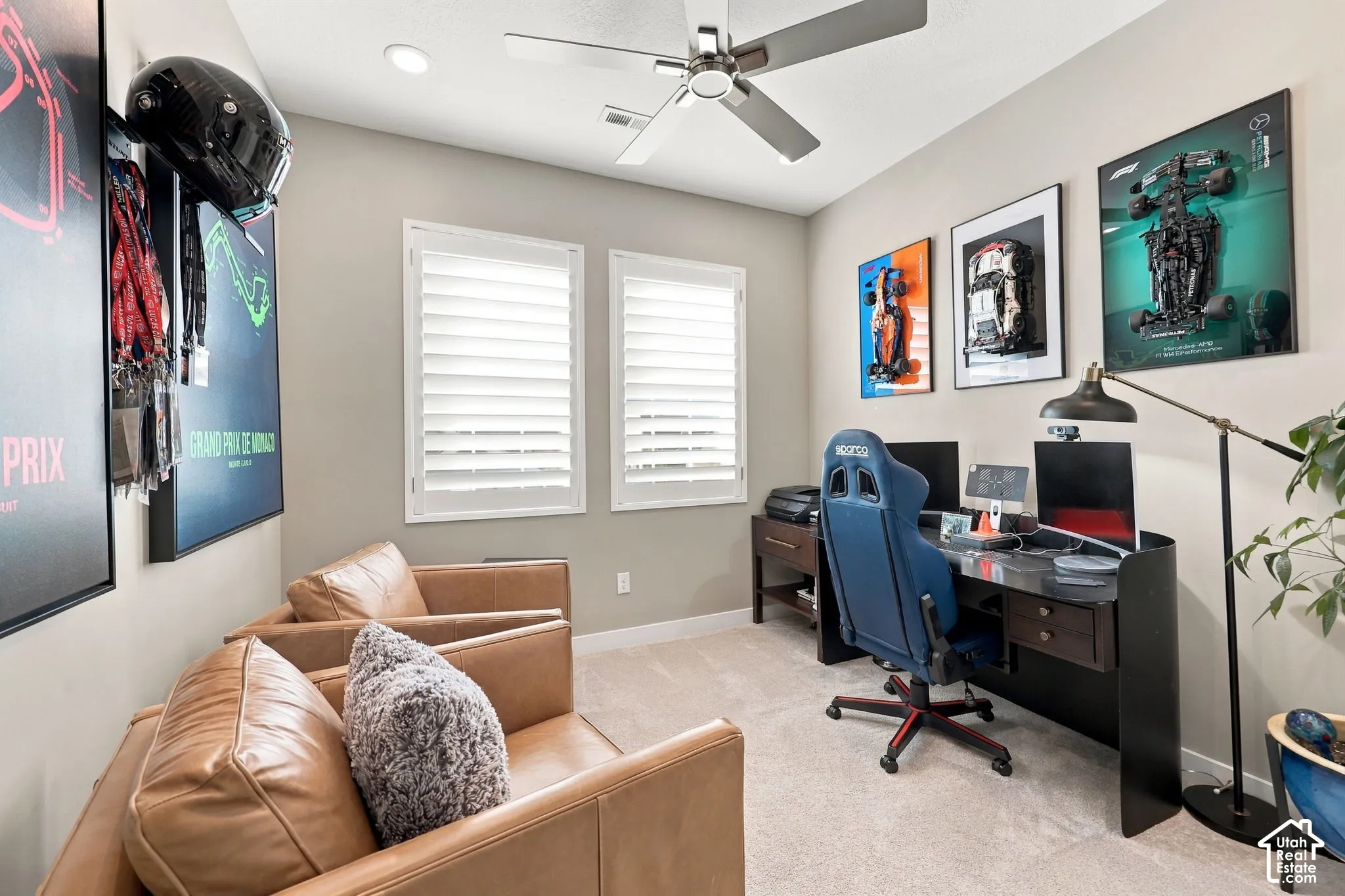 Recessed lighting, ceiling fan, two windows with plantation shutters, light-toned carpeting, and neutral wall paint