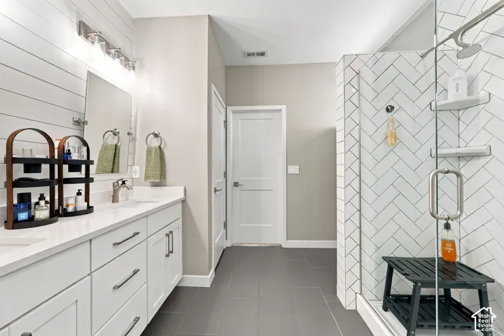 Dual vanity with white cabinetry and integrated sinks