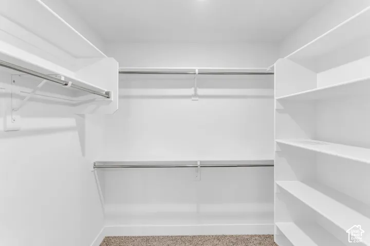 Spacious walk-in closet as part of primary suite.