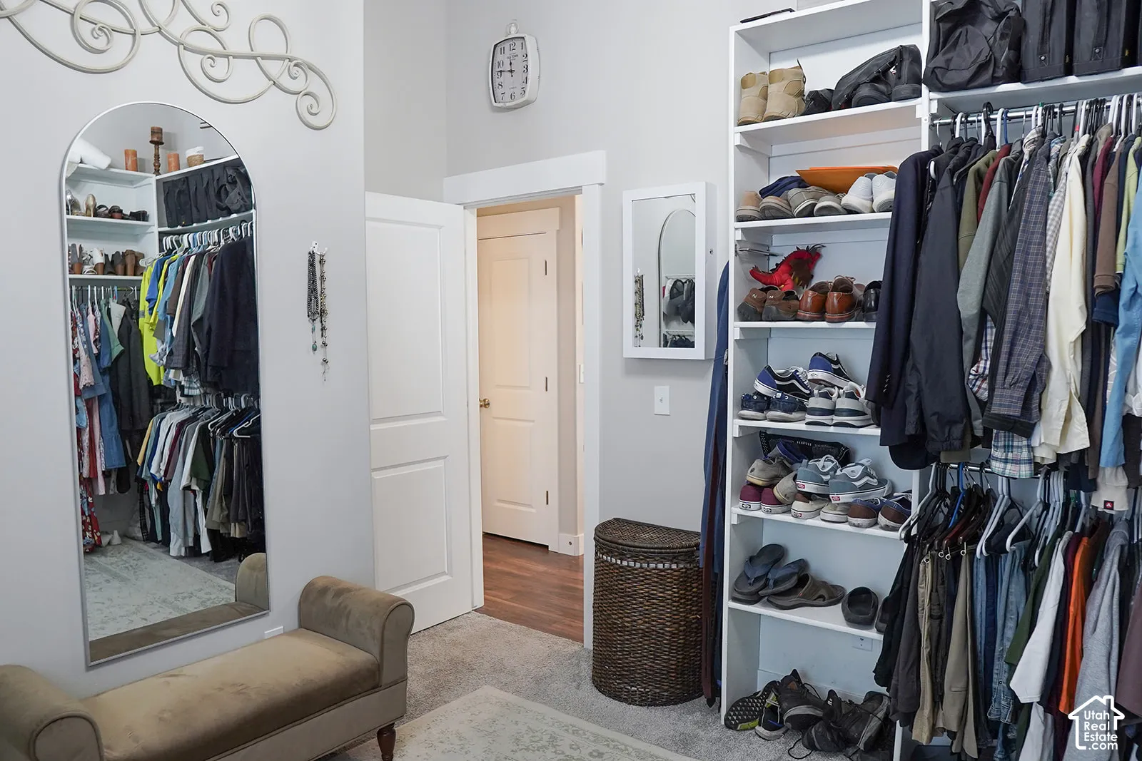 Built-in closet organization system with shelving and hanging rods