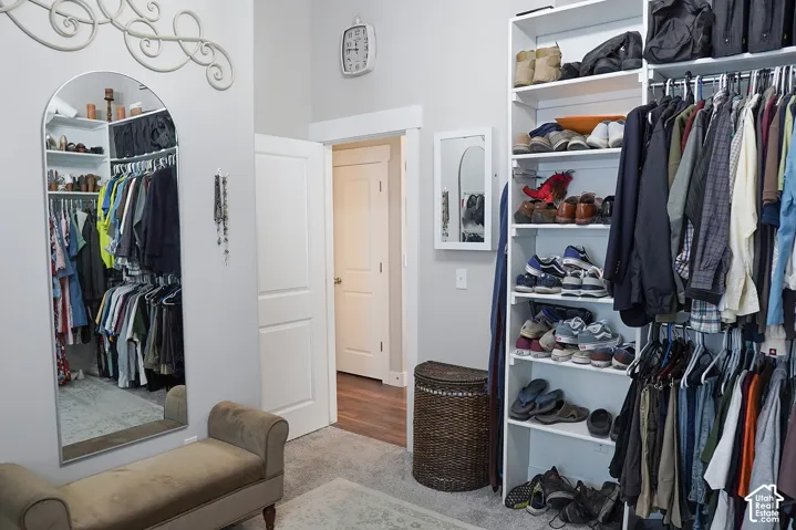 Built-in closet organization system with shelving and hanging rods