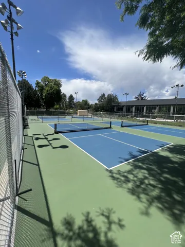Multiple pickleball courts with blue and green surfaces