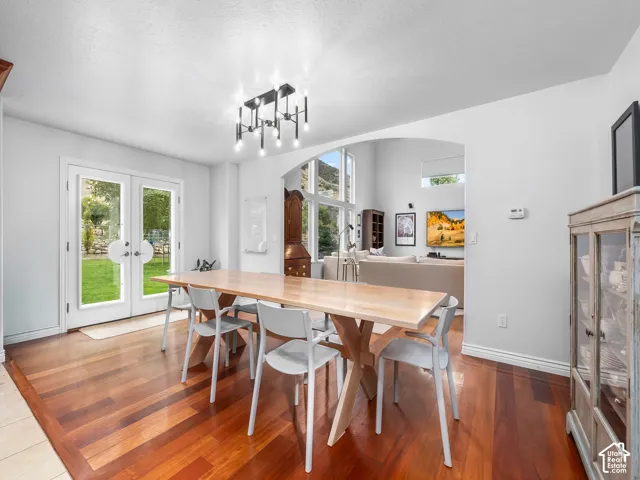 Wood-finish flooring with a modern linear chandelier