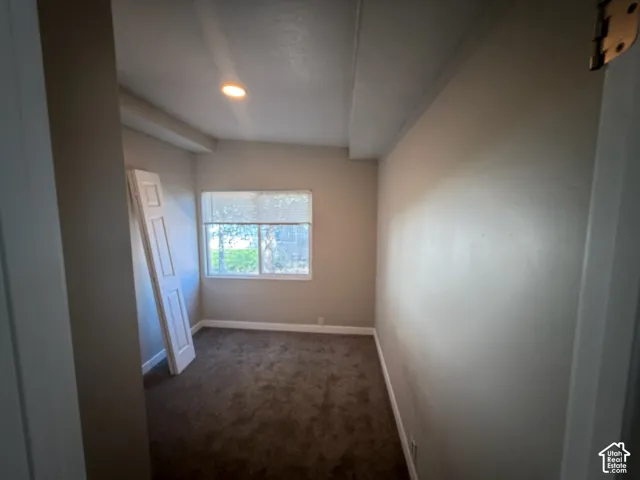 Recessed ceiling lighting, window with exterior exposure, and neutral-toned wall paint
