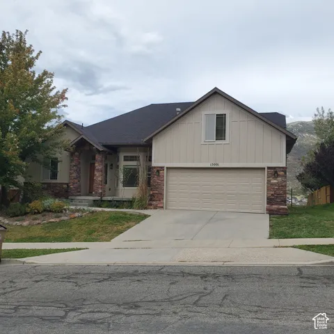 Stone and stucco exterior with board and batten accents
