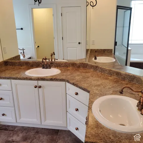 Dual undermount sinks with bronze-finish fixtures