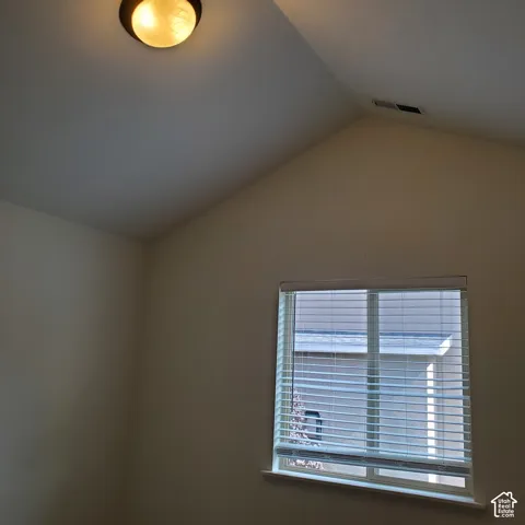 Vaulted ceiling with an attached flush-mount light fixture