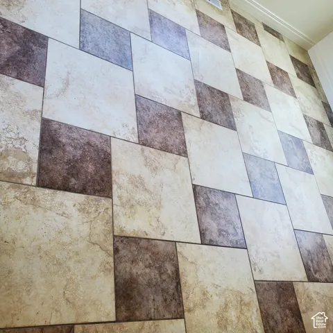Two-tone rectangular floor tile in a geometric pattern