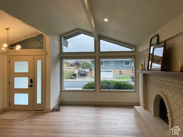 Vaulted ceiling featuring exposed beams and recessed lighting