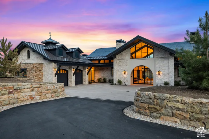 Stone veneer exterior with dark metal roofing