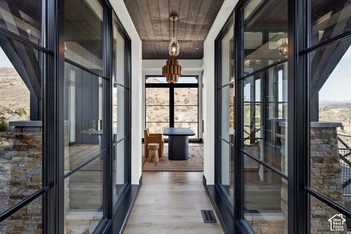 Wood-finish flooring with a dark wood plank ceiling