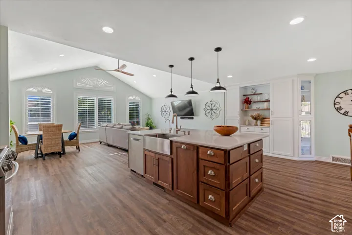 Vaulted ceiling with recessed lighting and ceiling fan