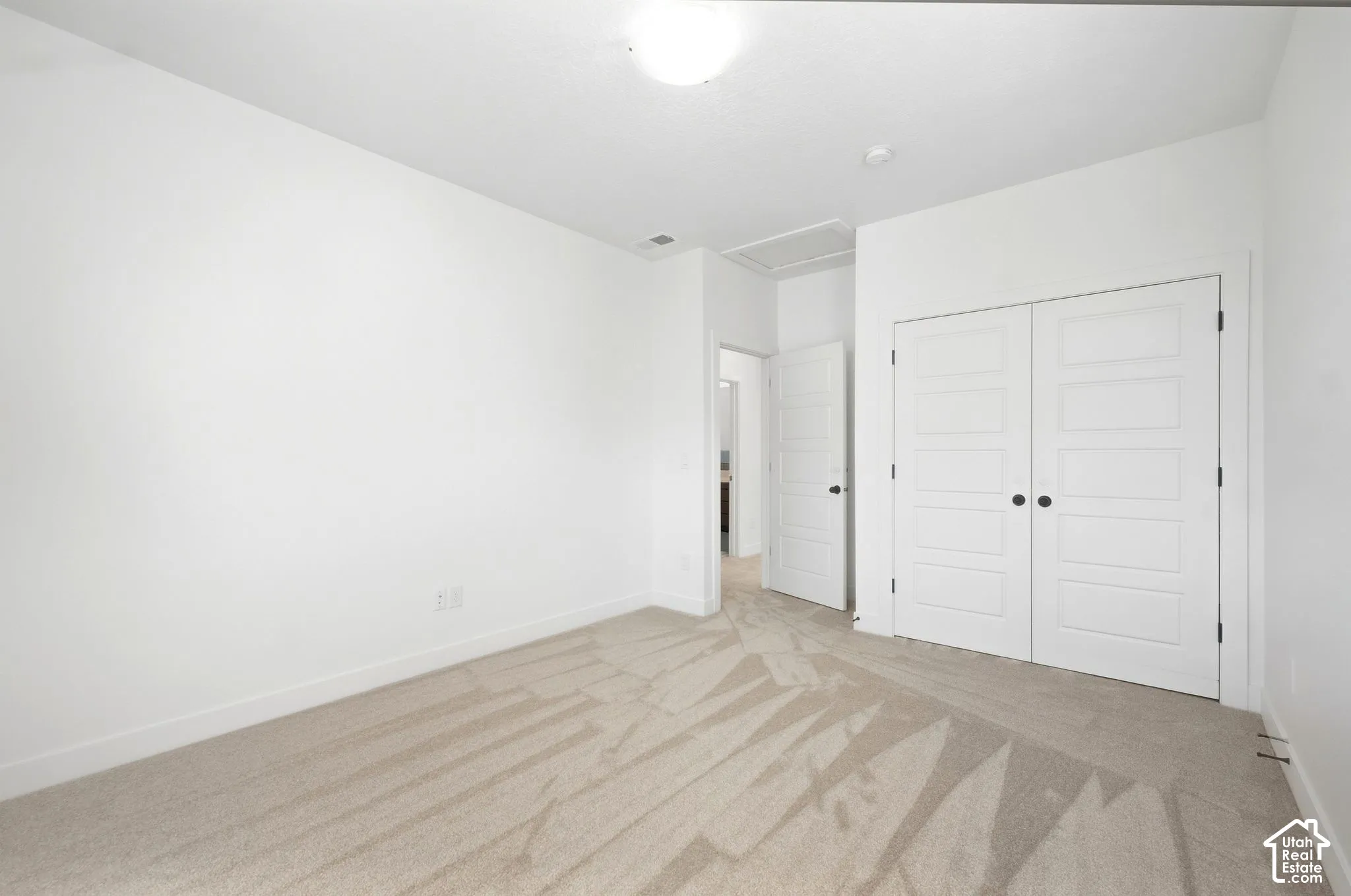 3rd bedroom. Neutral tone wall finish with carpet flooring