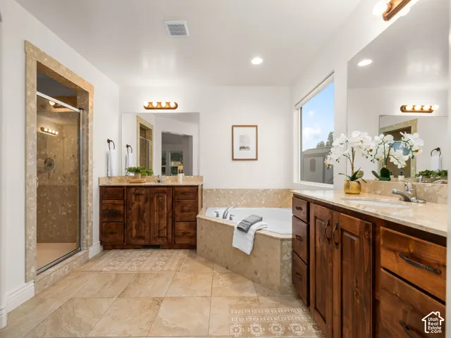 Dual vanities with integrated sinks and stone countertops