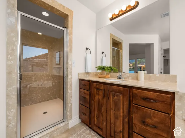 Spacious shower with glass enclosure and built-in window
