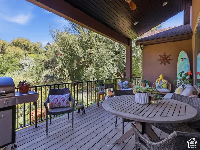 Covered outdoor deck with wood-finish flooring