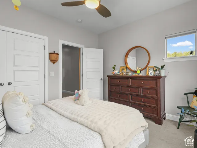 Neutral gray wall paint, recessed lighting, and a ceiling fan with integrated lighting